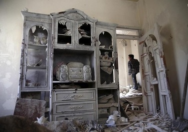  ویرانه‌های ناشی از حملات شورشیان در حومه دمشق 